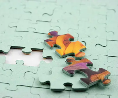 A close up of a puzzle piece missing