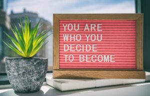 A sign that says you are who you decide to become.