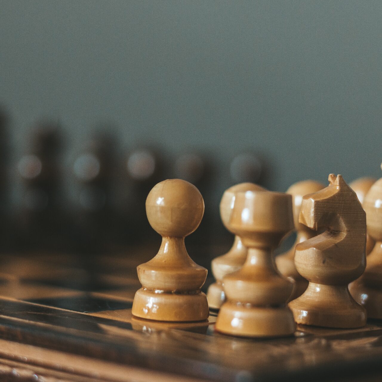 A close up of some wooden chess pieces